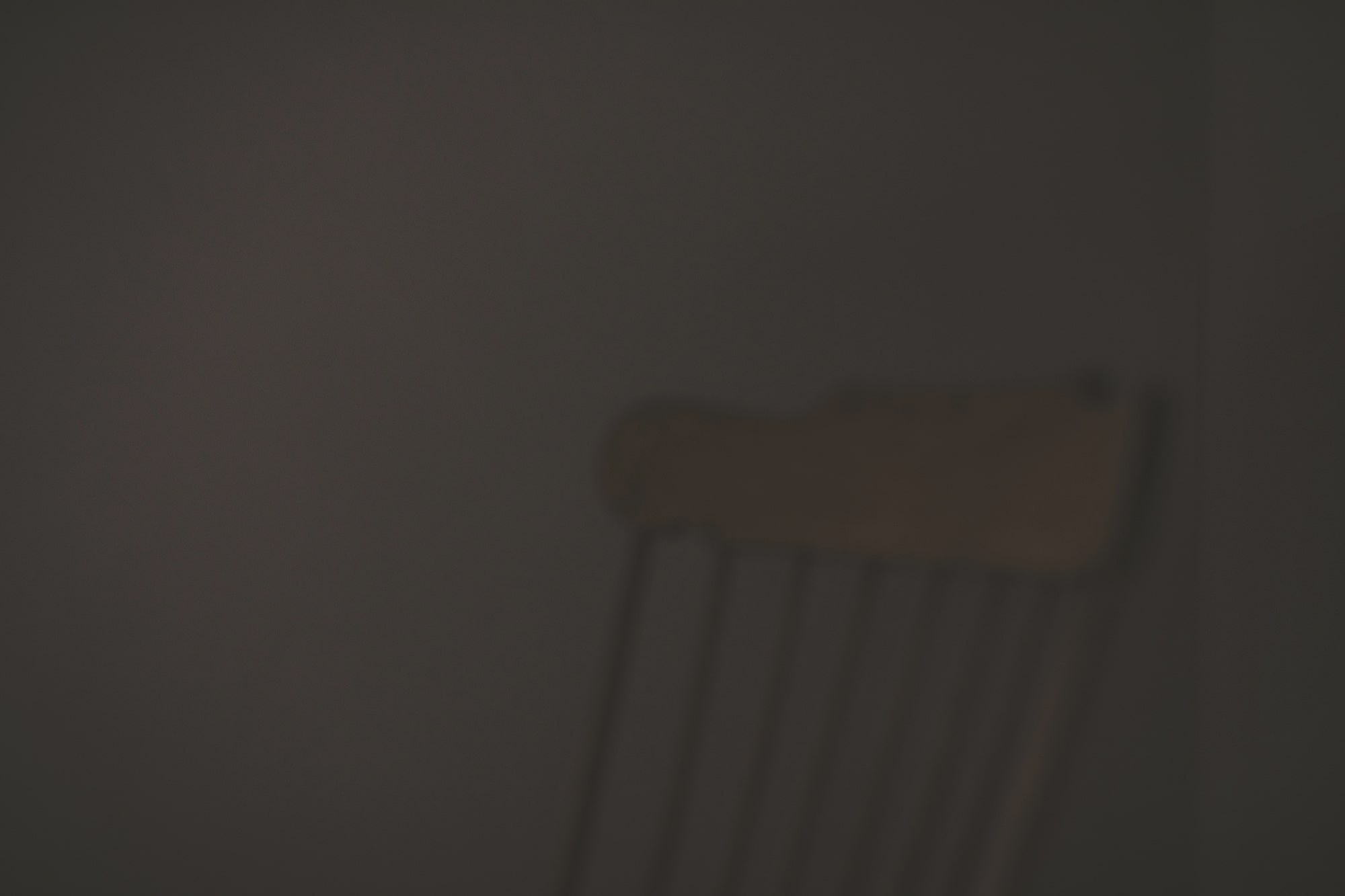 Wooden chair in dark room